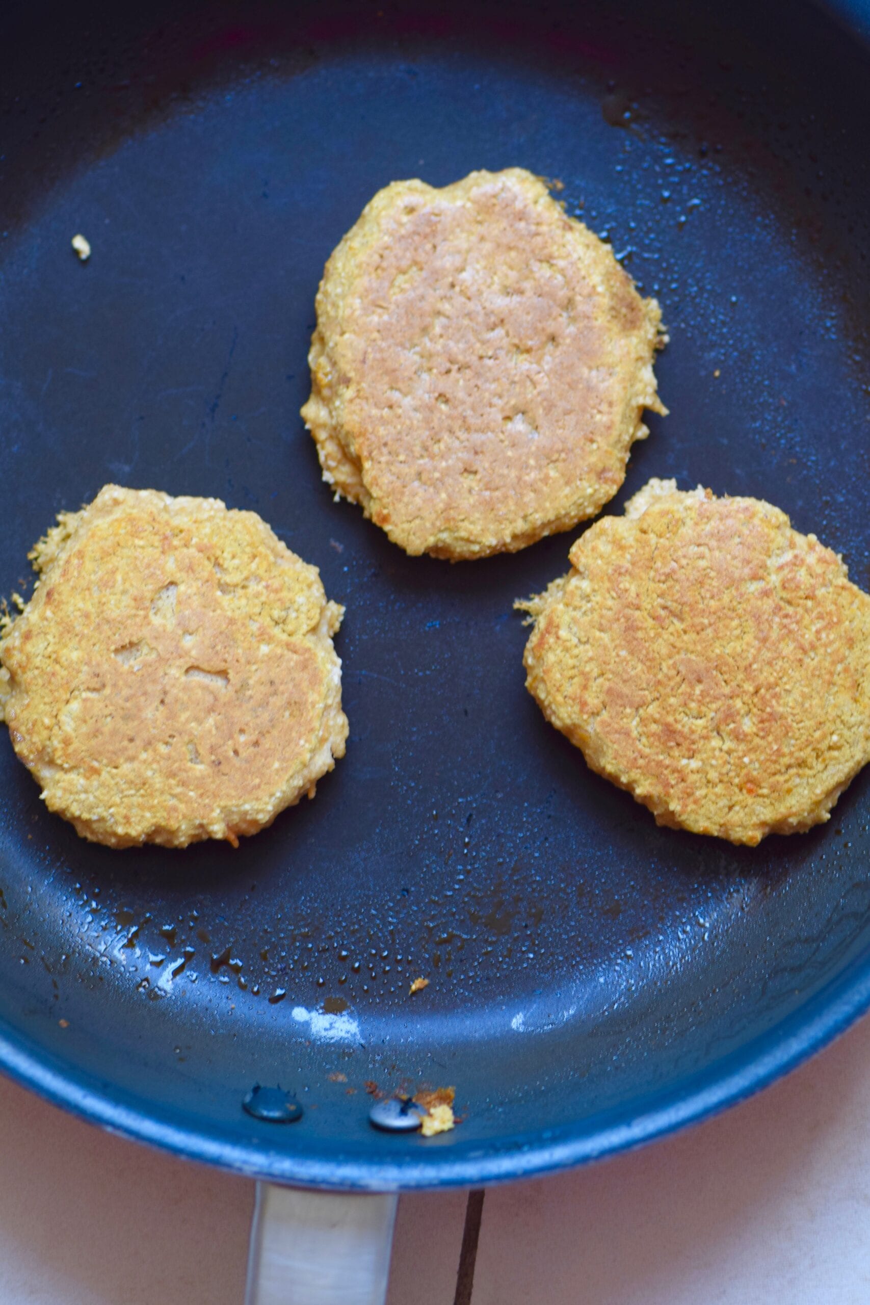 Cooked pancakes on frying pan