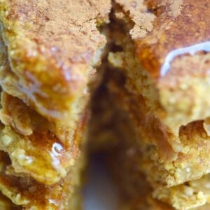 Protein pumpkin pancakes stack with a piece cut out of it
