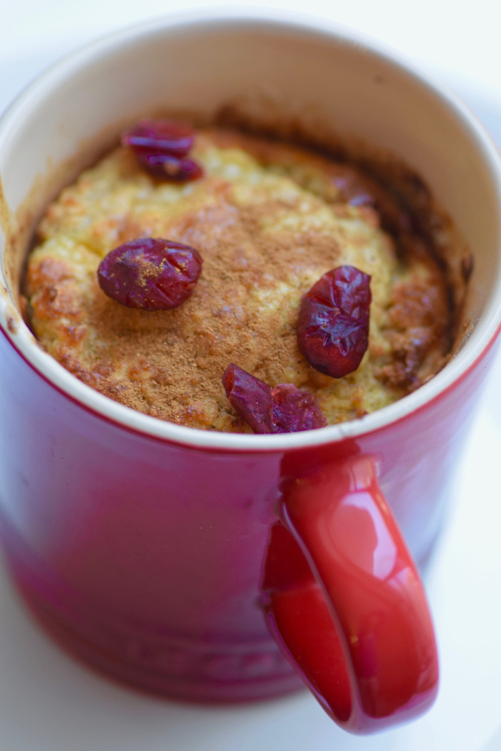 Healthy banana muffin mug cake with cranberries
