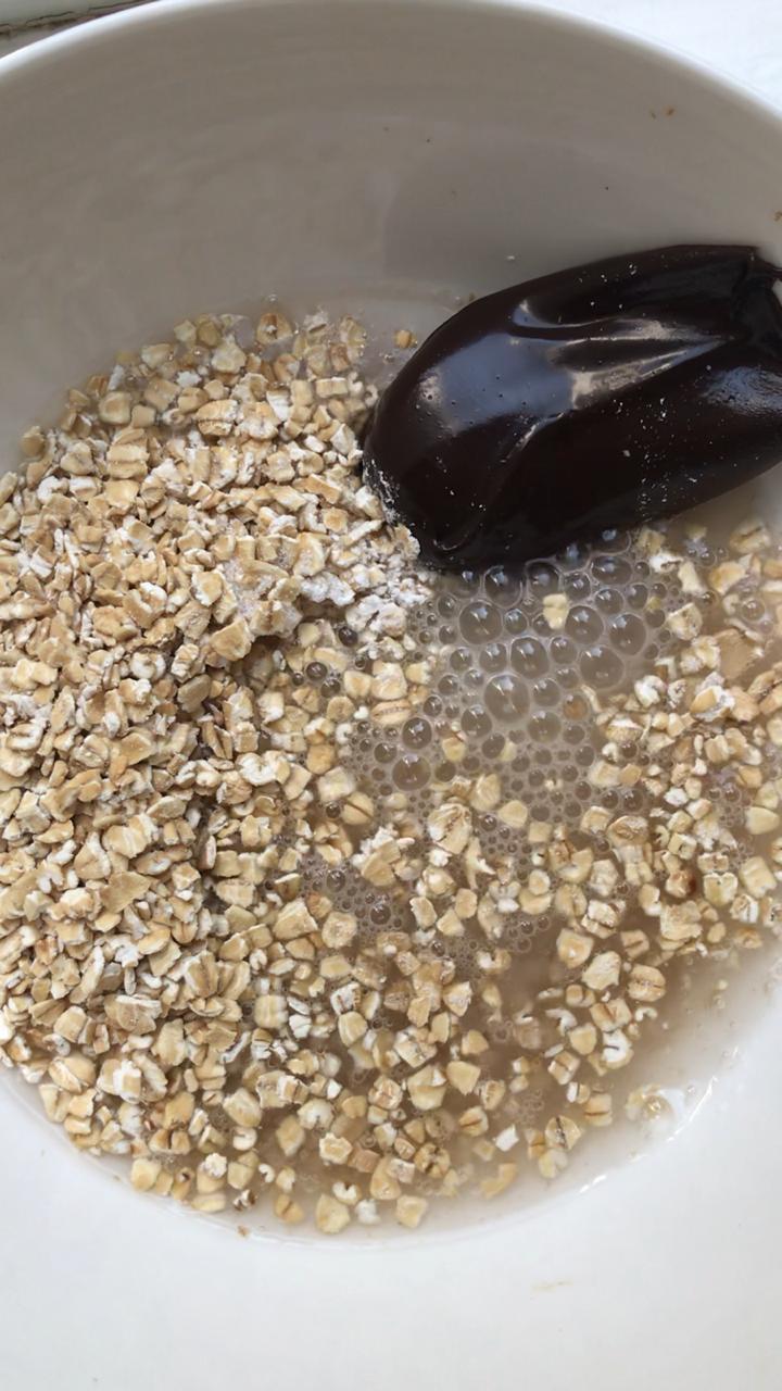 Mixing raw ingredients for hot fudge baked oatmeal