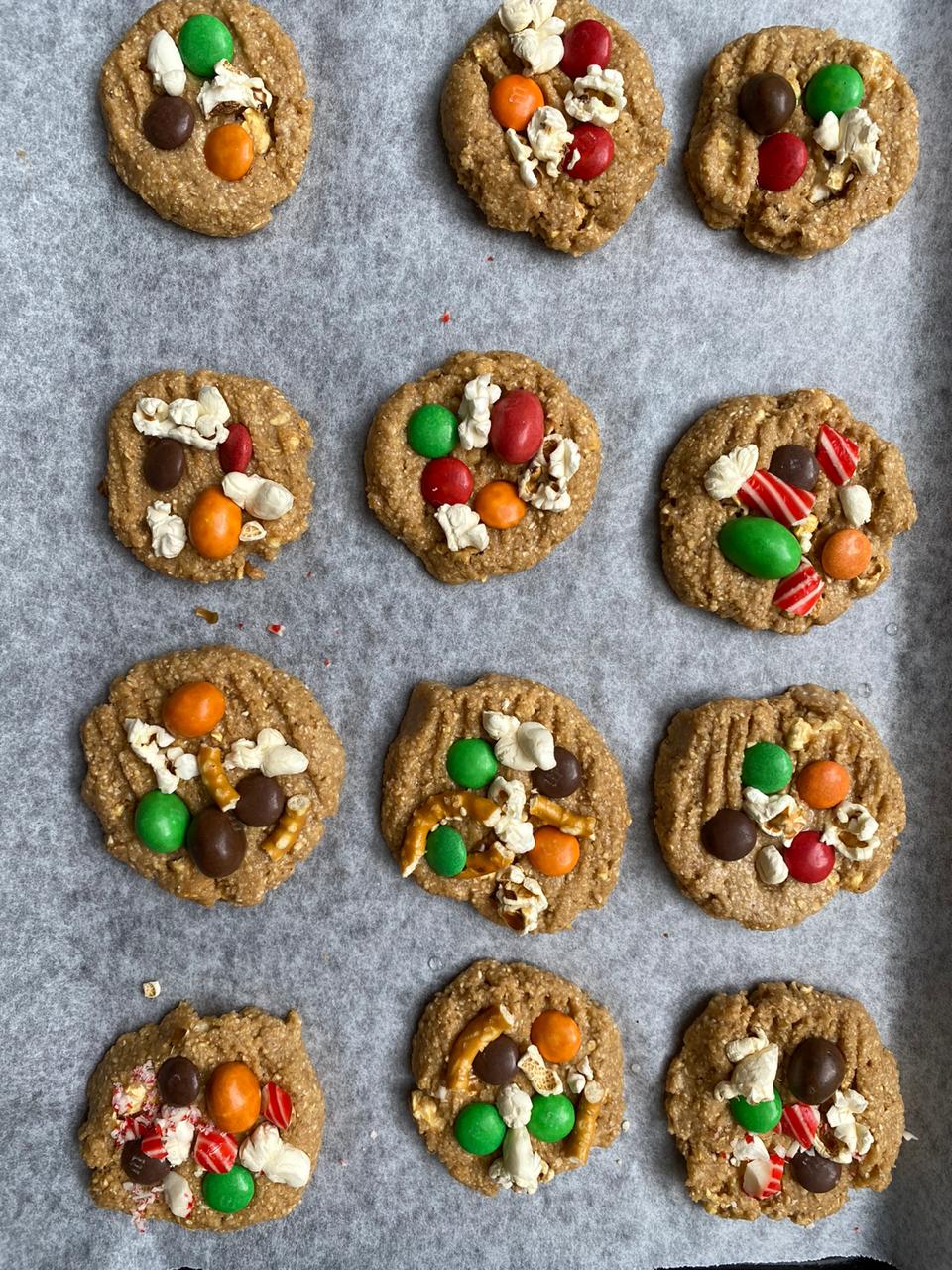 adding toppings to the easy christmas cookies