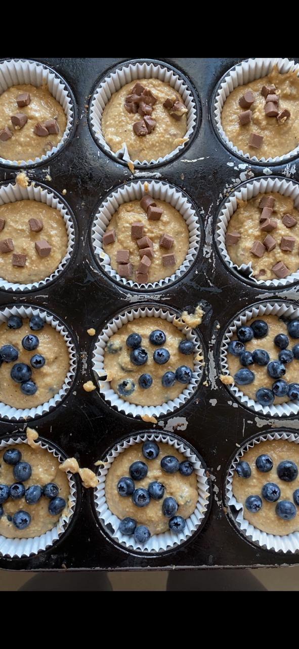 Placing the muffin mixture inside the muffin tins