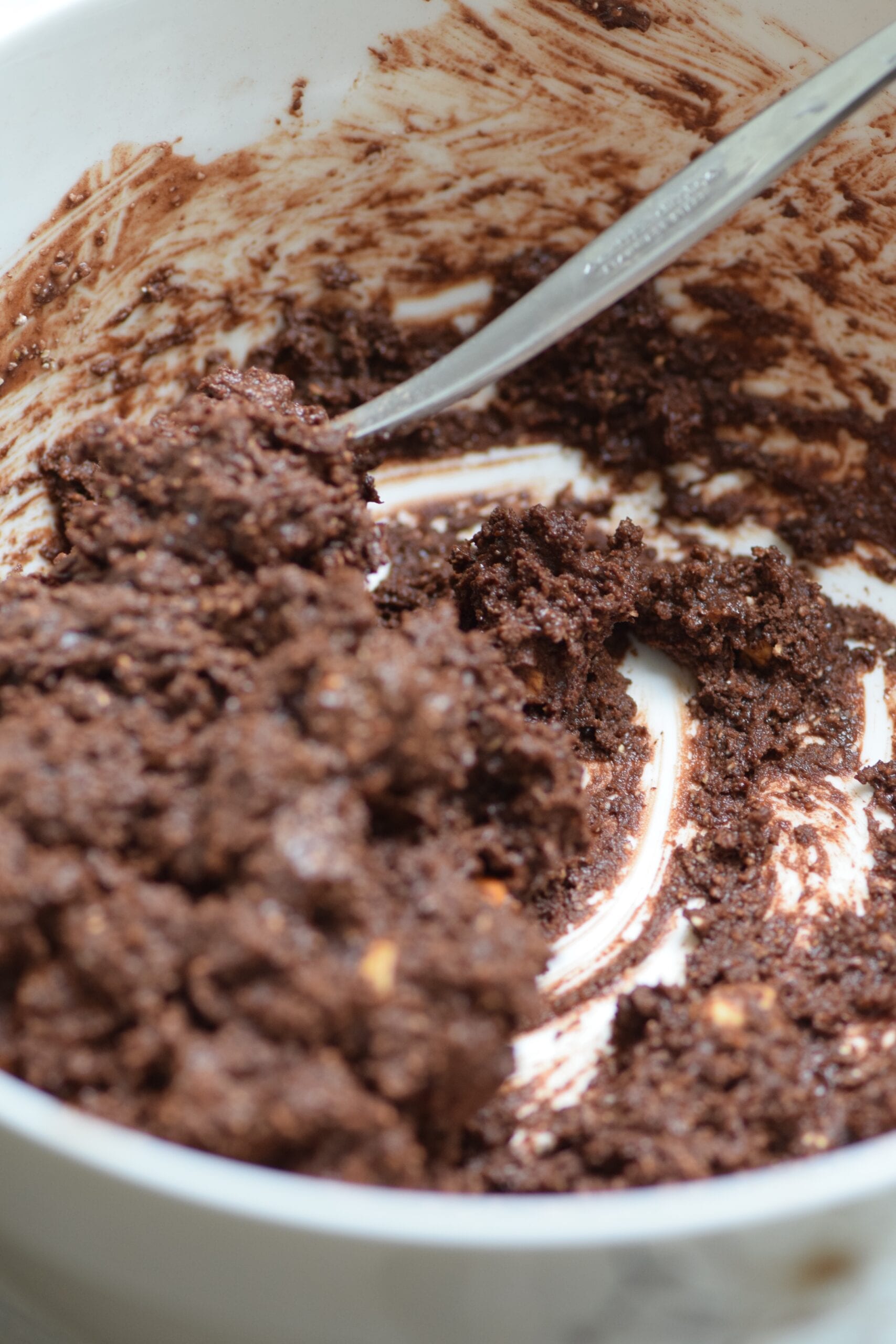 Mixing ingredients for fudgy chocolate brownie cookies