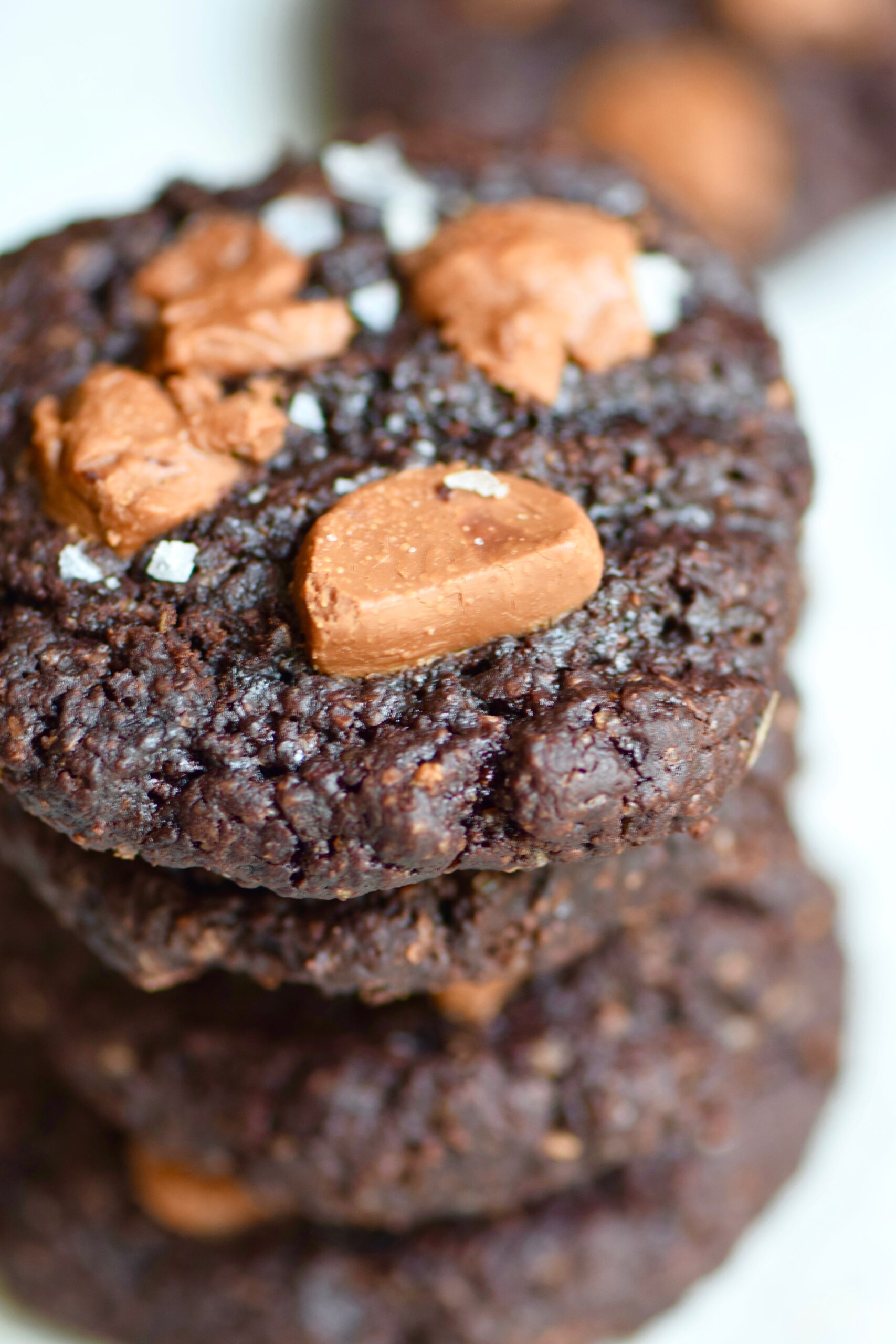 Stack Of Ultimate Fudgy Brownie Cookies with chocolate chips and sea salt