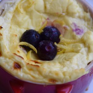 5 Minute Protein Cheesecake In a Mug with blueberries and lemon